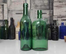 425 - Set of 2 Vintage Green Glass Collectible Decorative Bottles
