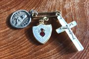 3 medals on a pin