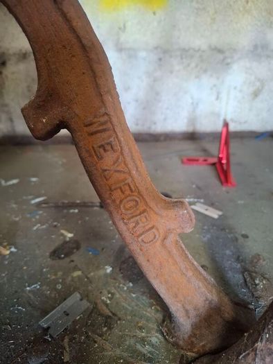 old garden  bench ends with wexford written on them
