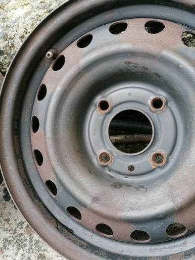 2 x steel rims 15", 4 stud, about 114mm ish from hole centre to the opposite home centre... Possibly fit a nissan etc