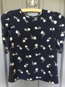 Pennys shirt sleeved girls top aged 10-12 years