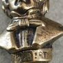 This brass bust appears to be a vintage docertive item / paperweight and pipe tamper or desk accessory depicting the composer Schubert, featuring his name clearly inscribed on the base. Image 6