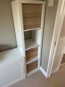 White IKEA Kallax unit including 2 baskets and 2 drawers