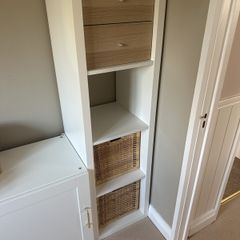 White IKEA Kallax unit including 2 baskets and 2 drawers