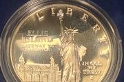 American 1986s silver dollar. Ellis Island
