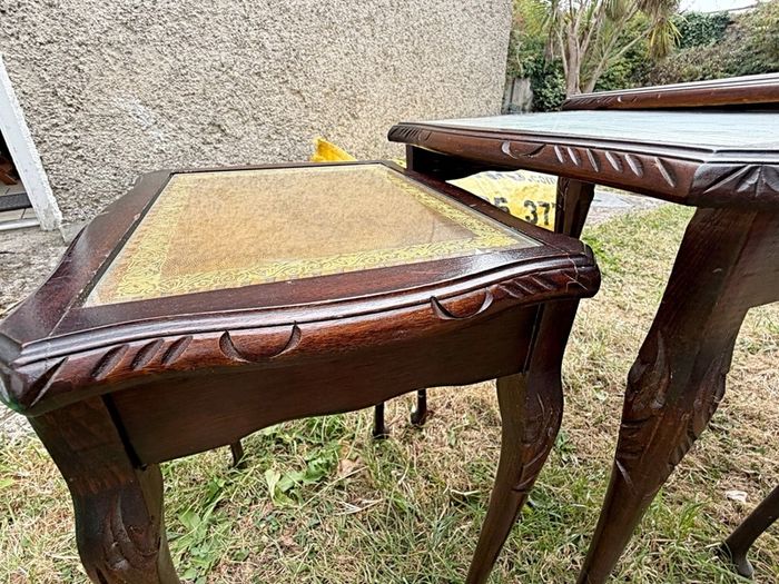 A vintage glass-protected, gold-tooled, leather top nest of tables
