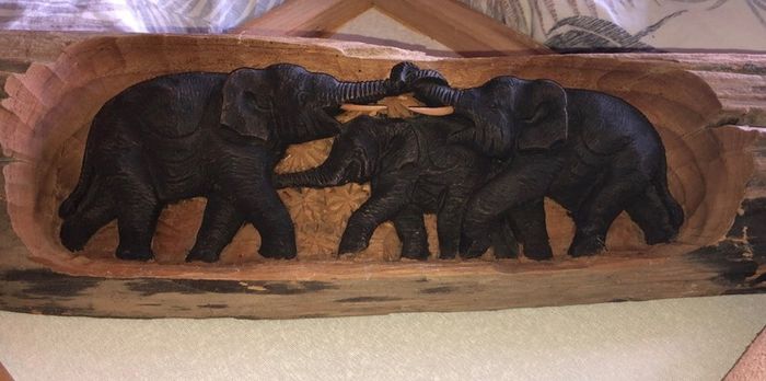 Hand carved wood.