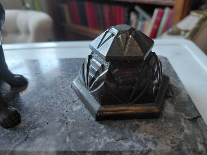 Antique desk inkwell with a seated dog on marble stand