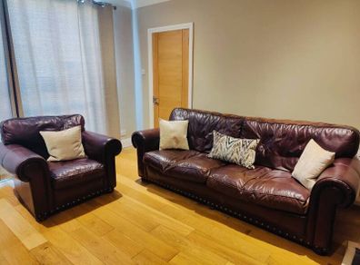 Brown leather sofa and arm chair
