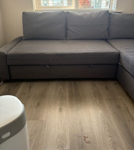 Corner sofa-bed with storage, dark grey