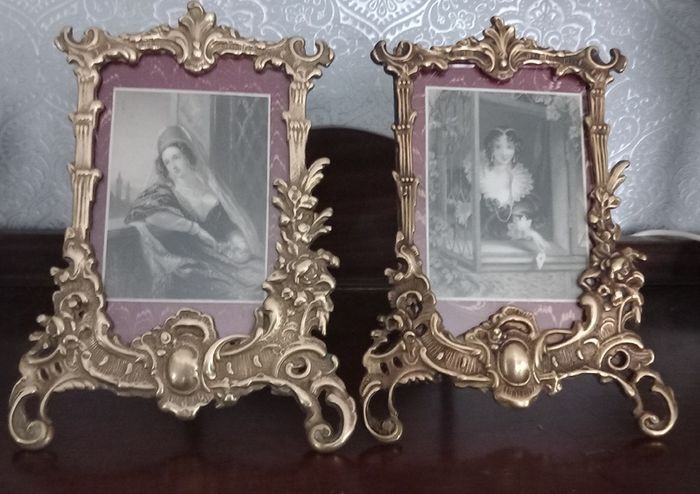 Pair of brass picture frames.