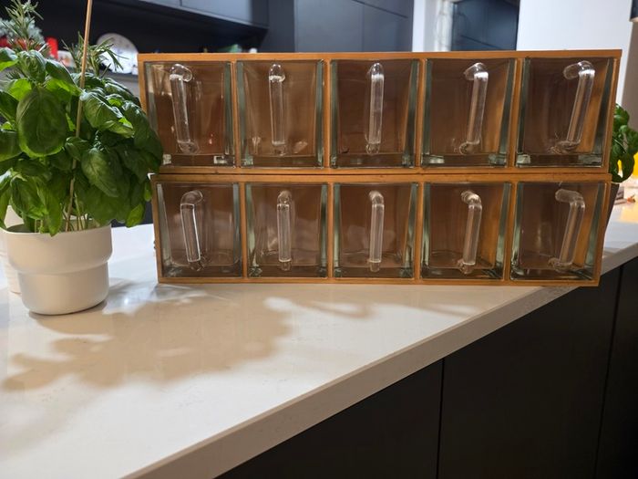 Wooden display shelf with glass jugs