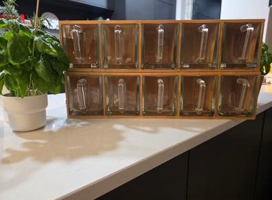 Wooden display shelf with glass jugs