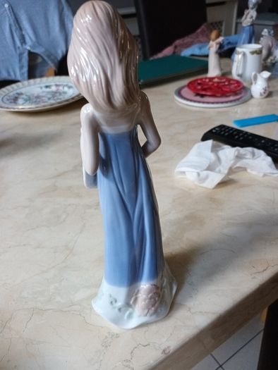 Cellini  Collection  Posing  With Her Hat.  (Unboxed).