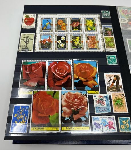 Ace Black 32 page/ 16 leaf Stamp Album with over 900 stamps. Thematic of Animals, Plants, Classic Cars, Space, Trains, Sport & Disney noted.