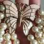 A beautiful faux pearl butterfly bracelet. Image 5