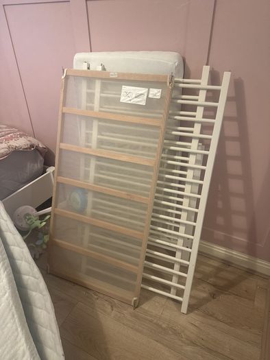 white cot with mattress