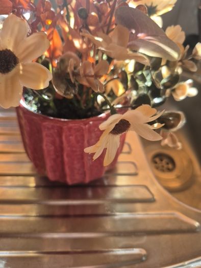 Small orange and tan fake flowers