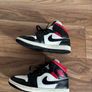 Nike Air Jordan 1 Mid trainers in the classic black, white and red colourway Image 3