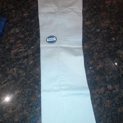 Boy's Nautica cream chino trousers. Age 10