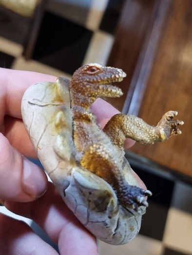 Hatching dinosaur toy figurine