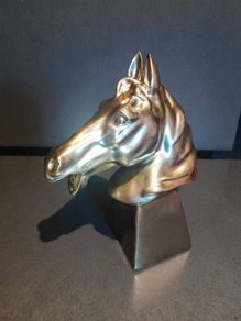 Large ceramic horse head statue
