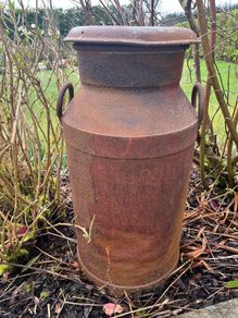 Vintage rustic creamery can