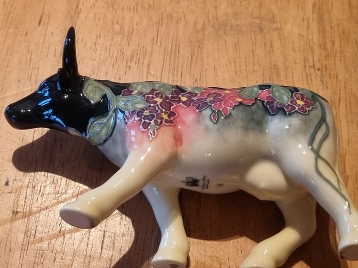 Porcelain colorful cow figurine