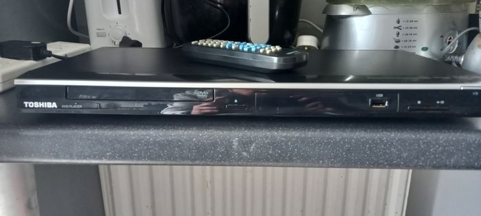 Toshiba DVD/CD/USB Player plus bag of dvd's