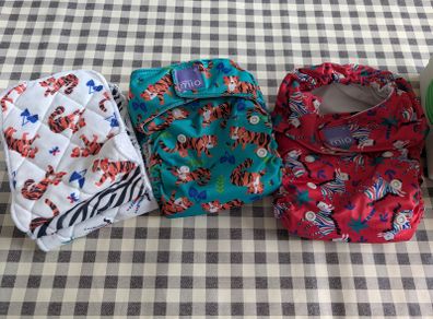 Reusable nappies and liners