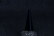 A Vivienne Westwood ring in black with black stones.