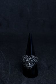 A Vivienne Westwood ring in black with black stones.