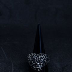 A Vivienne Westwood ring in black with black stones.