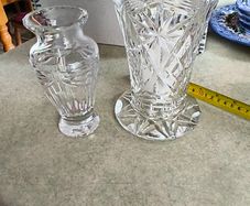 Is  2 crystal Vases-  Antique American Brilliant Cut Glass Trumpet Vase     8 and 1/2 inches tall 65.00 euro.-- the other one 6 inches Flower Vase Pompeii Collection by Waterford Crystal 32.00 euro.