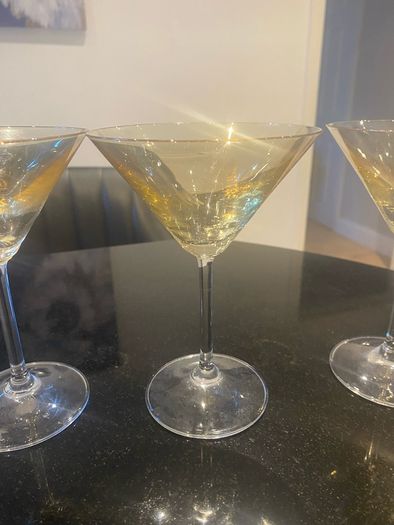 Set of four amber and plain glass martini or cocktail glasses