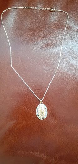 chain and our lady of Guadalupe pendant
