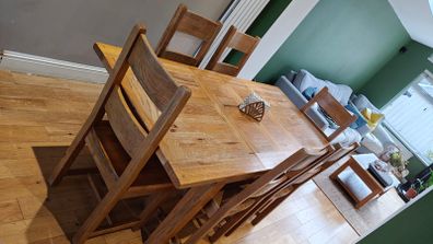 Solid wood oak extending dining table with matching chairs