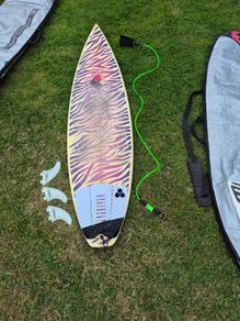 3 surfboards with fins, leash and bags
