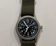 Escapement time field watch