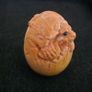 Carved wooden dragon hatching from an egg. Image 2