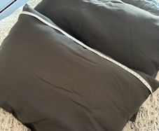 6 x grey garden cushions + 1 black one