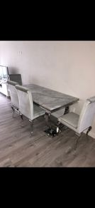 Heavy marble table with chairs