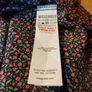 Missguided dress features a ditsy floral print on a black background with button detailing. New with Tags. Image 7