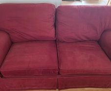 Living room / lounge couch in dark burgundy red