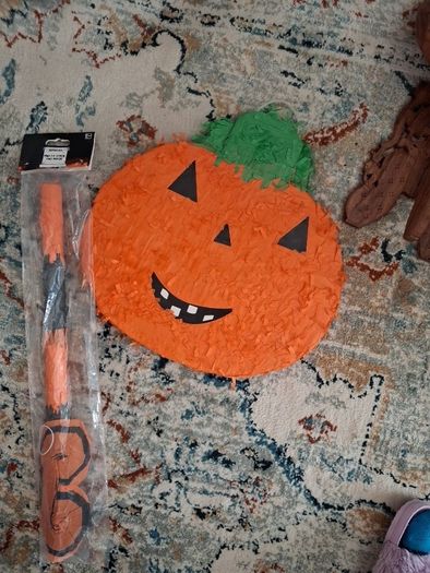 Halloween Pinata with stick and mask.