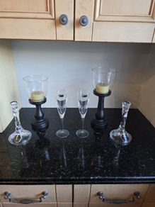 Killarney crystal candle holders and glasses 2 of each and 2 wooden candle stands.