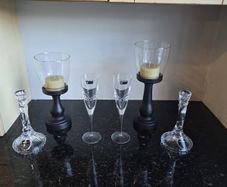 Killarney crystal candle holders and glasses 2 of each and 2 wooden candle stands.