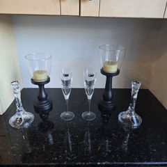 Killarney crystal candle holders and glasses 2 of each and 2 wooden candle stands.