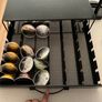 Nespresso Vertuo Coffee Machine with pods storage and leftover pods Image 4