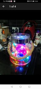 large glass candle lantern with coloured lights